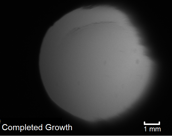 Photo of Argon solid after growth before any cracks form.